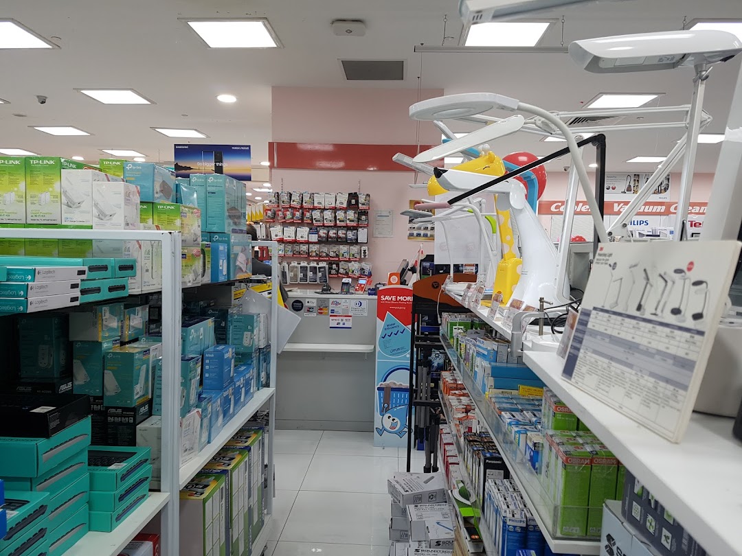 Interior view of an electronics store with shelves of products and display items.