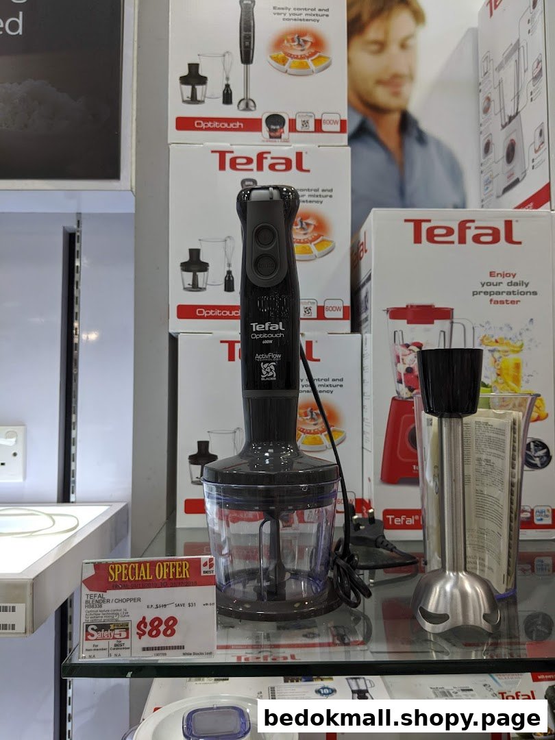 Display of Tefal blenders and choppers with a special offer sign.