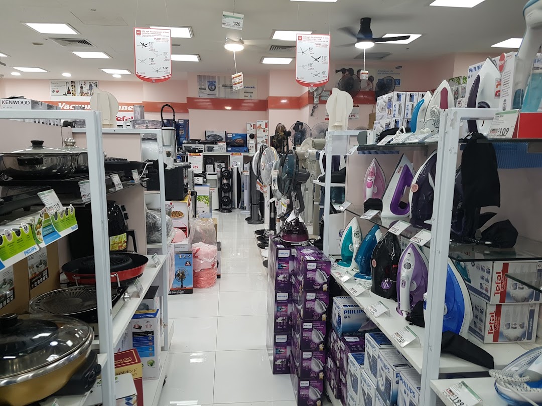 Interior of an electronics store displaying home appliances and kitchenware.
