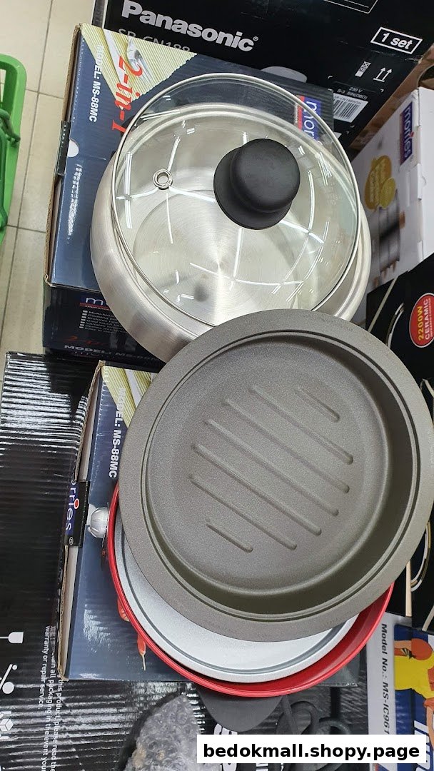 Kitchen appliances, including a pot and grill pan, displayed on boxes.