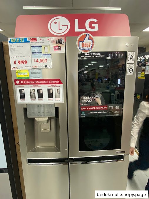 An LG multi-door refrigerator on display in an electronics store.