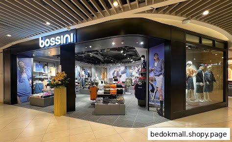 Exterior view of a Bossini clothing store with display windows and entrance.