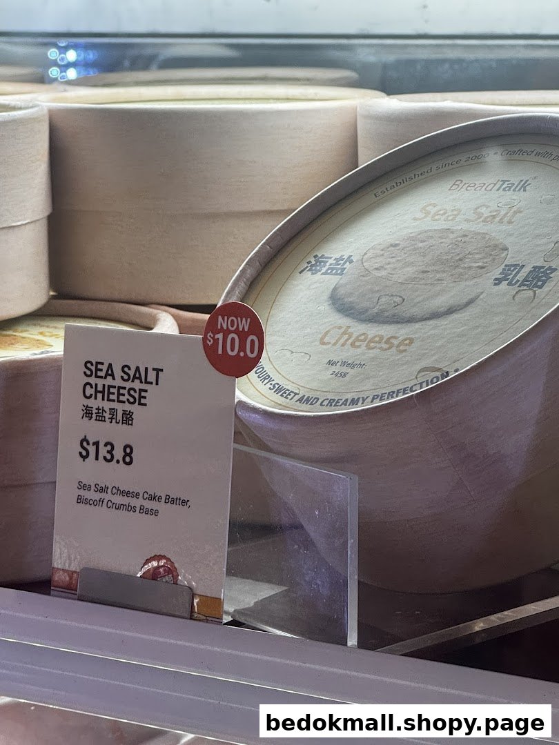 Sea Salt Cheese cake with price tag displayed in a refrigerated case.