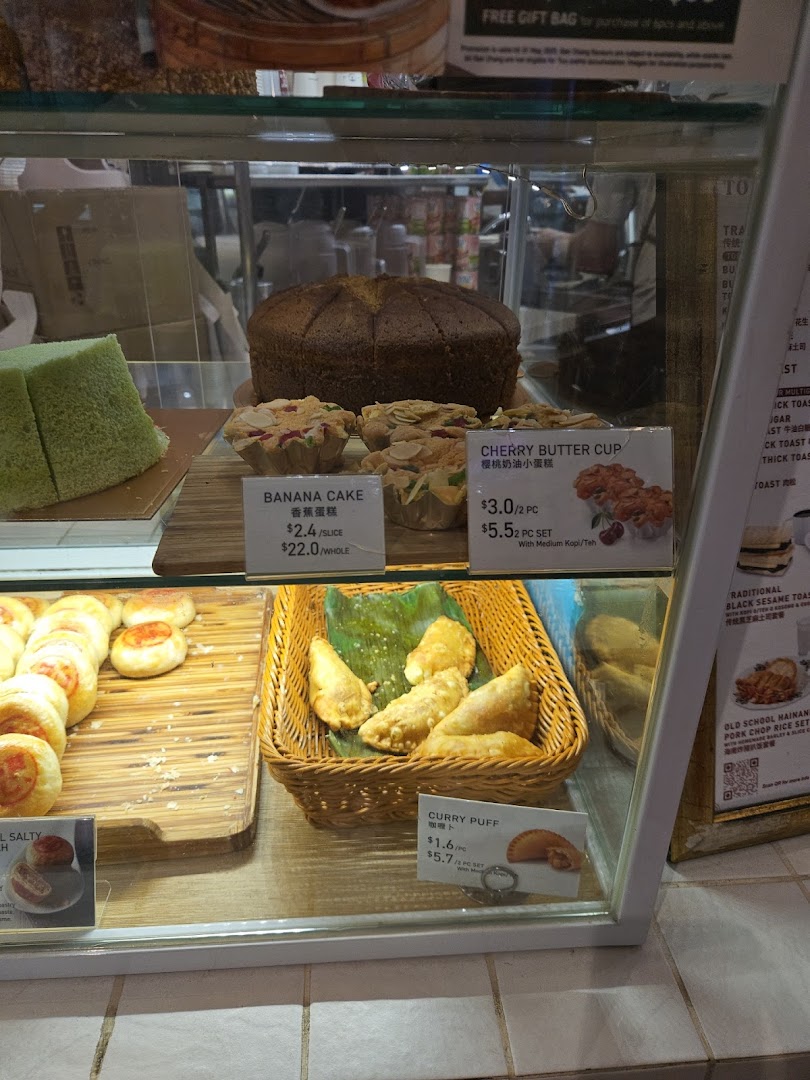 Display case filled with various baked goods and pastries for sale.