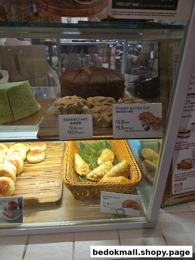 Display case filled with various baked goods and pastries for sale.