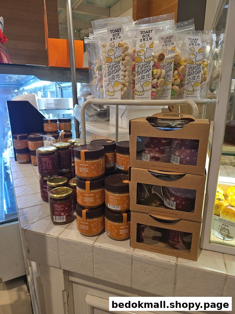 Various packaged snacks and jars of spreads displayed on a shop counter.