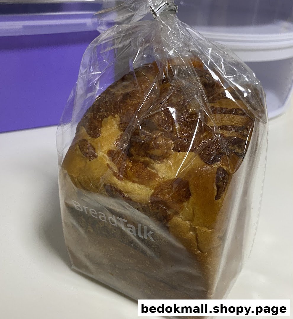 Close-up of a BreadTalk bread loaf in a clear plastic bag.