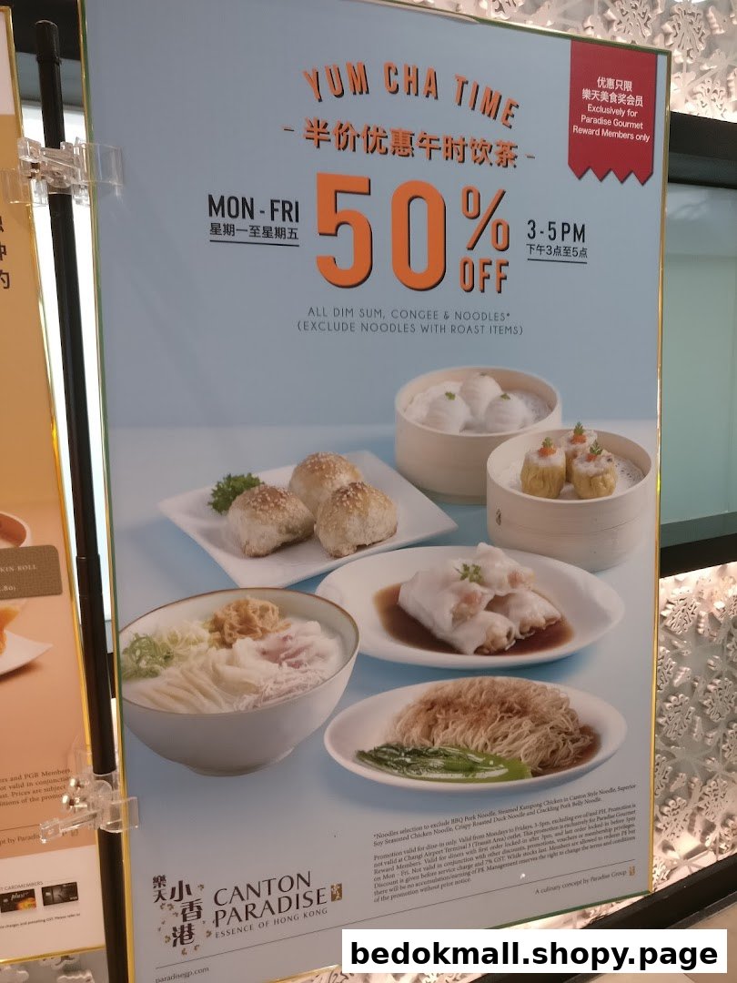 Large poster advertising dim sum and noodles with a 50% discount.