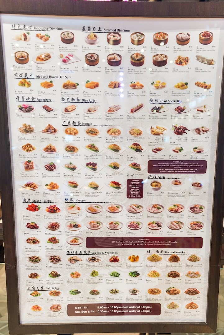 A large menu board displaying various Chinese dishes with pictures, names, and prices.
