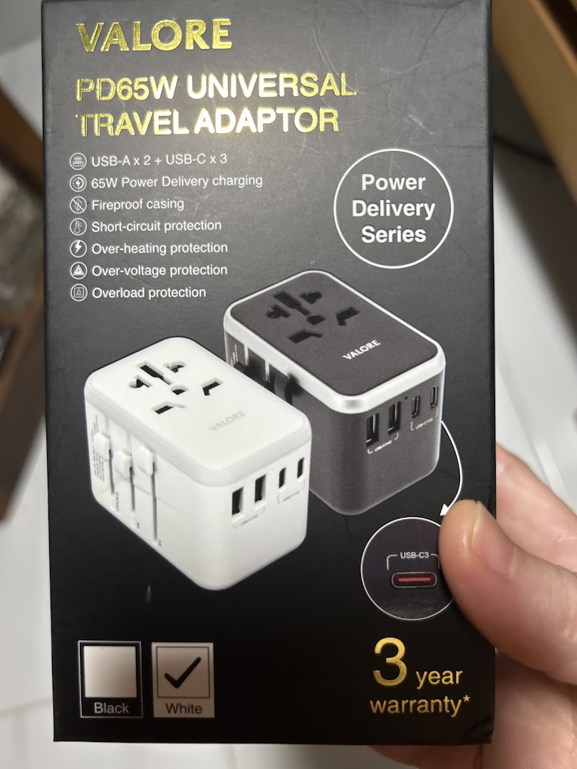 Product packaging for a Valore universal travel adaptor.