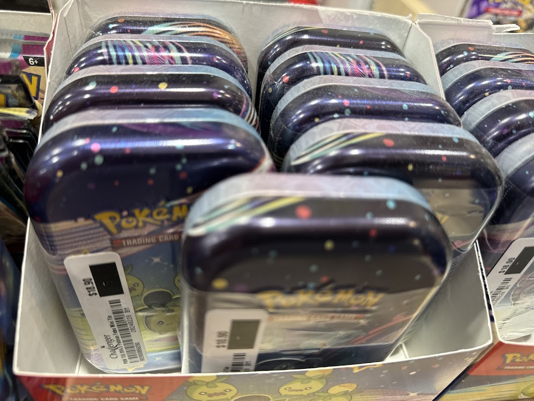 Multiple Pokemon Trading Card Game mini tins displayed in a retail box.