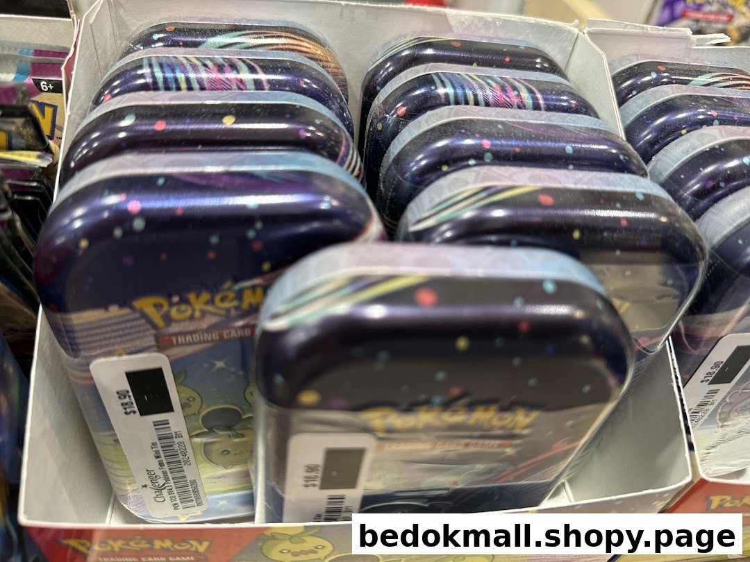 Multiple Pokemon Trading Card Game mini tins displayed in a retail box.