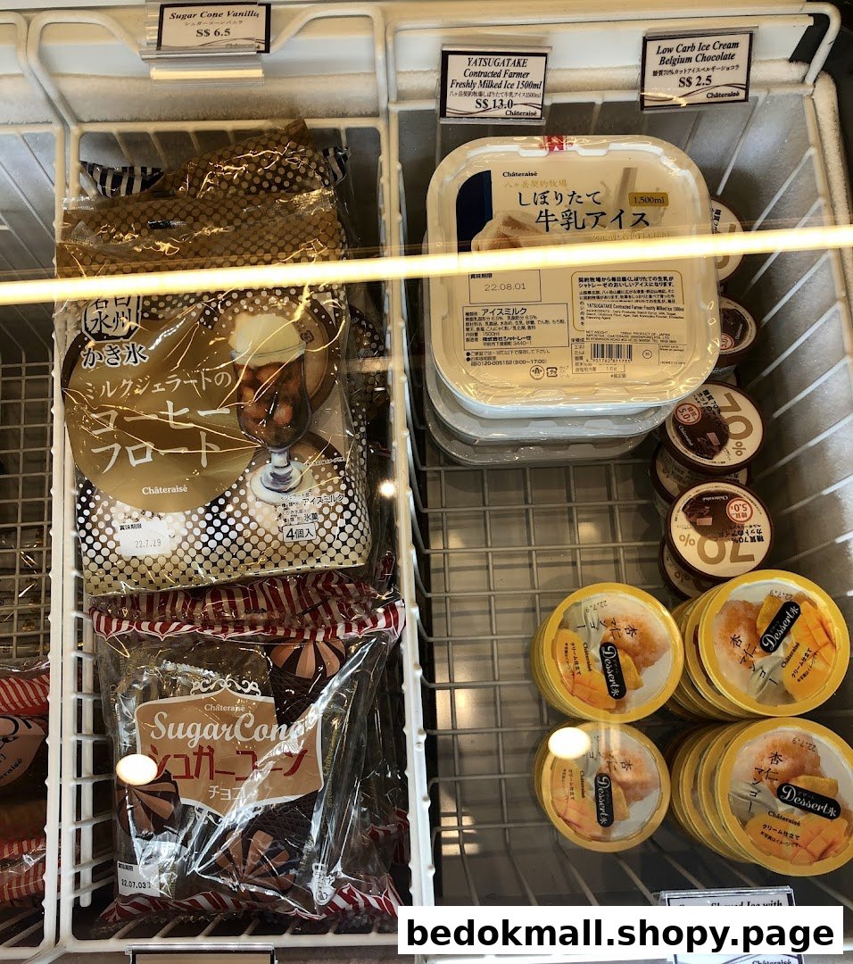Freezer display case filled with various packaged ice cream and desserts.