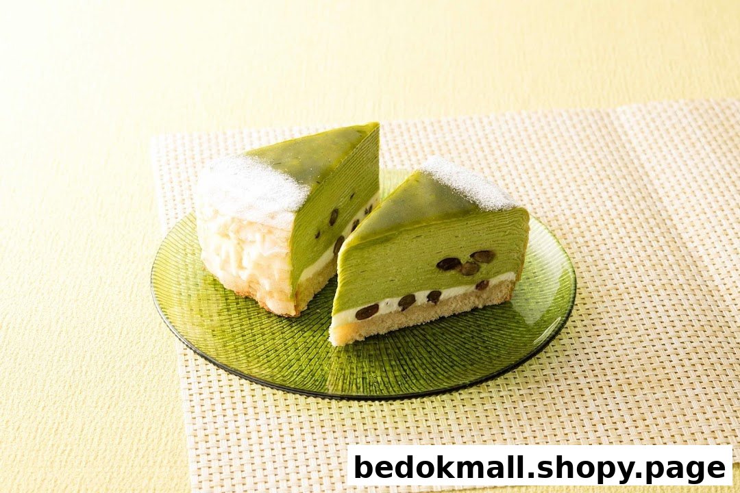 Two slices of green cake on a green plate with a textured background.