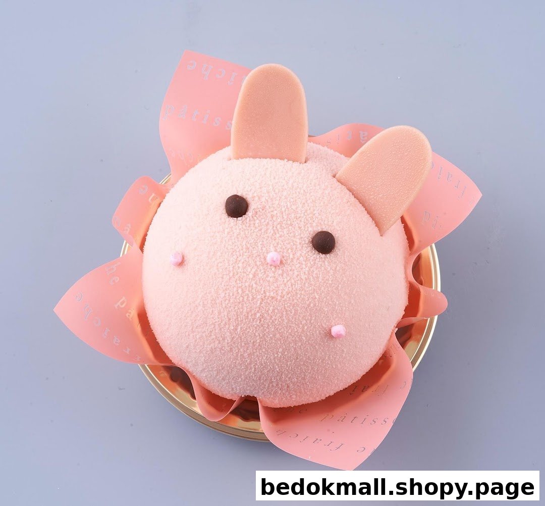 A pink, bunny-shaped dessert with chocolate eyes and pink ears.