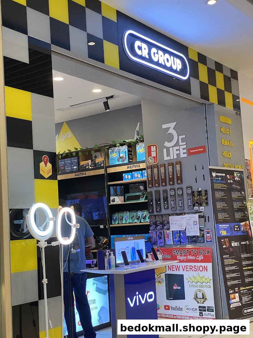 Front view of an electronics shop named CR Group.