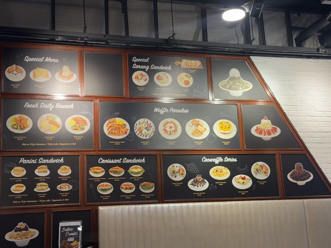 Wall-mounted menu boards displaying various food items and prices.