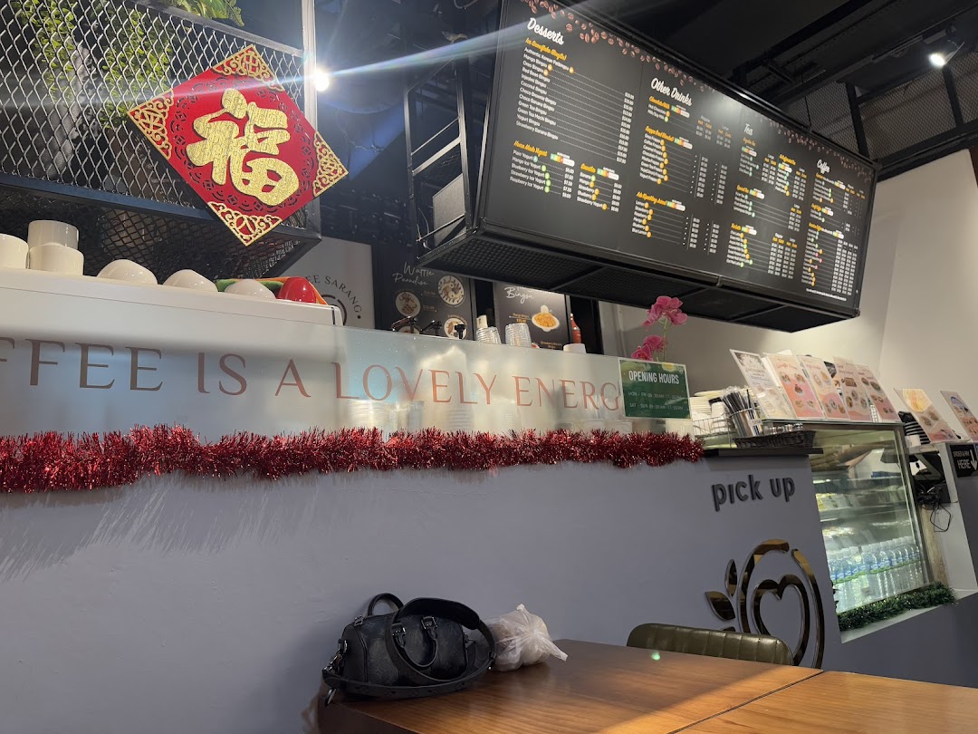 Interior view of a coffee shop with a large menu board and counter.