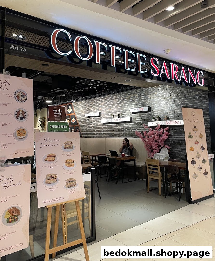Entrance of COFFEE SARANG coffee shop with menus outside and interior visible.