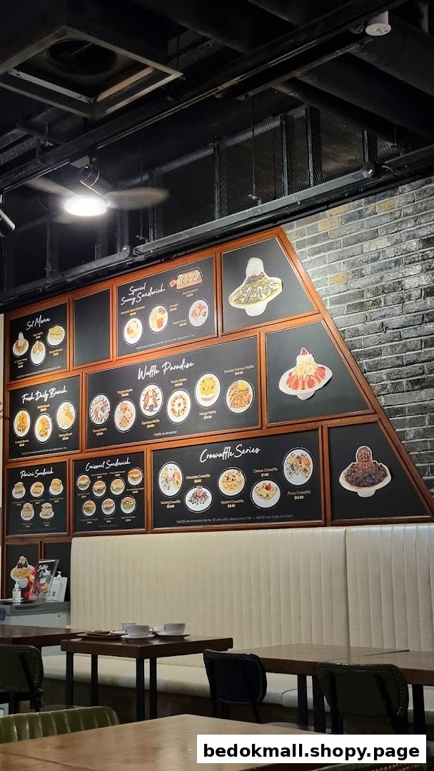 Cafe interior with a large wall-mounted menu displaying food items.
