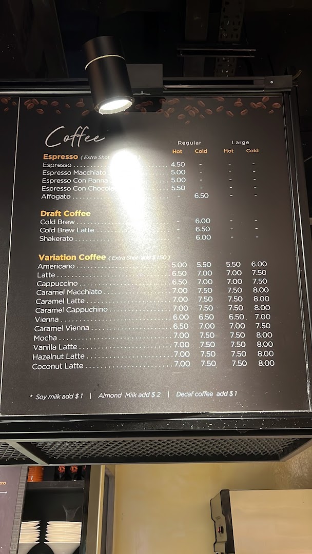 A coffee shop menu board displaying various coffee types and prices.