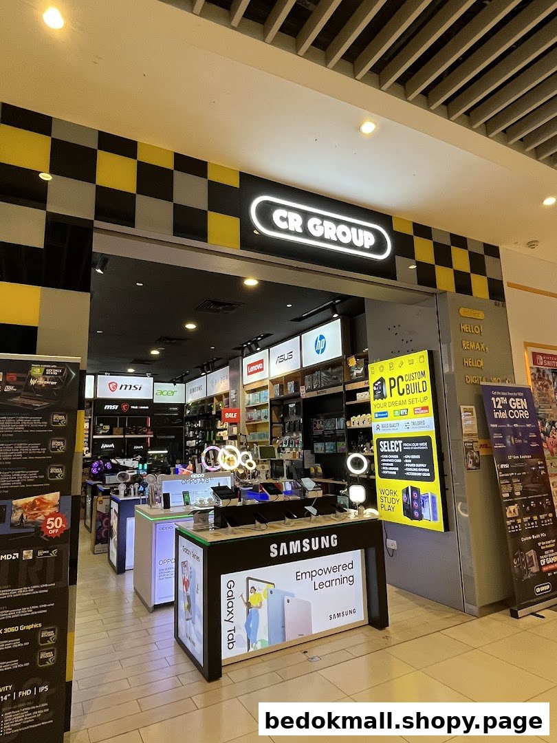 Entrance of an electronics shop with a Samsung display and various tech products.