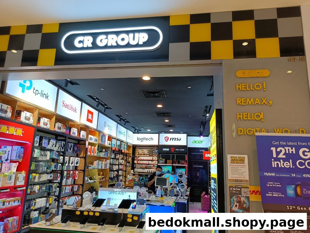 Entrance of an electronics shop with products and staff visible inside.