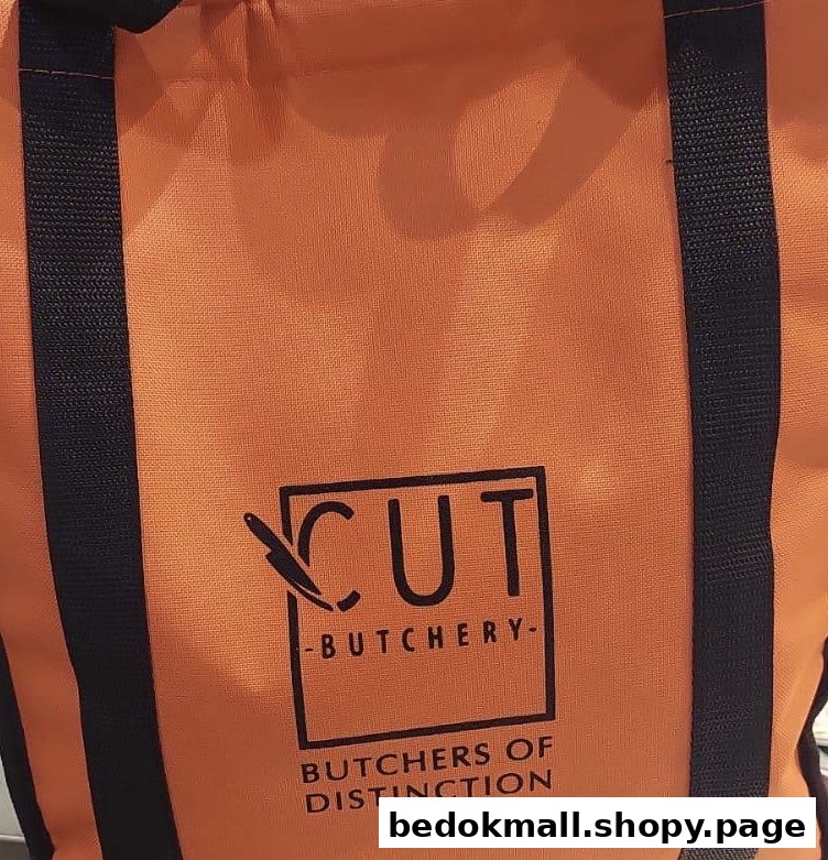 Orange reusable bag with the 'Cut Butchery' logo prominently displayed.