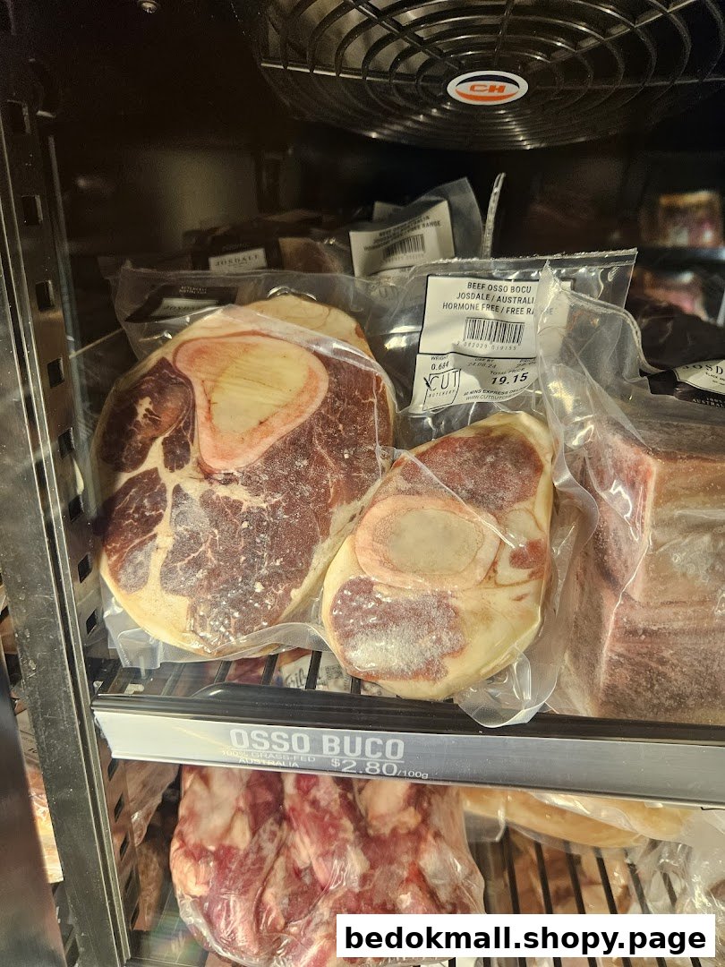 Packaged Osso Buco meat displayed in a refrigerated case with price labels.