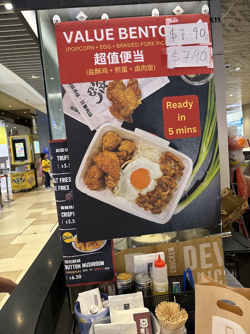 Large menu board displaying food items and prices at a counter.