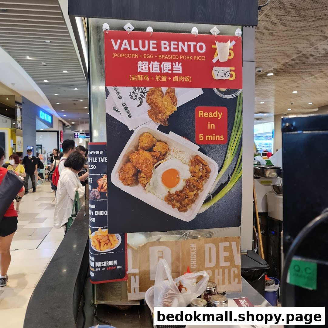 A large menu board displays a bento meal with price and other food items.