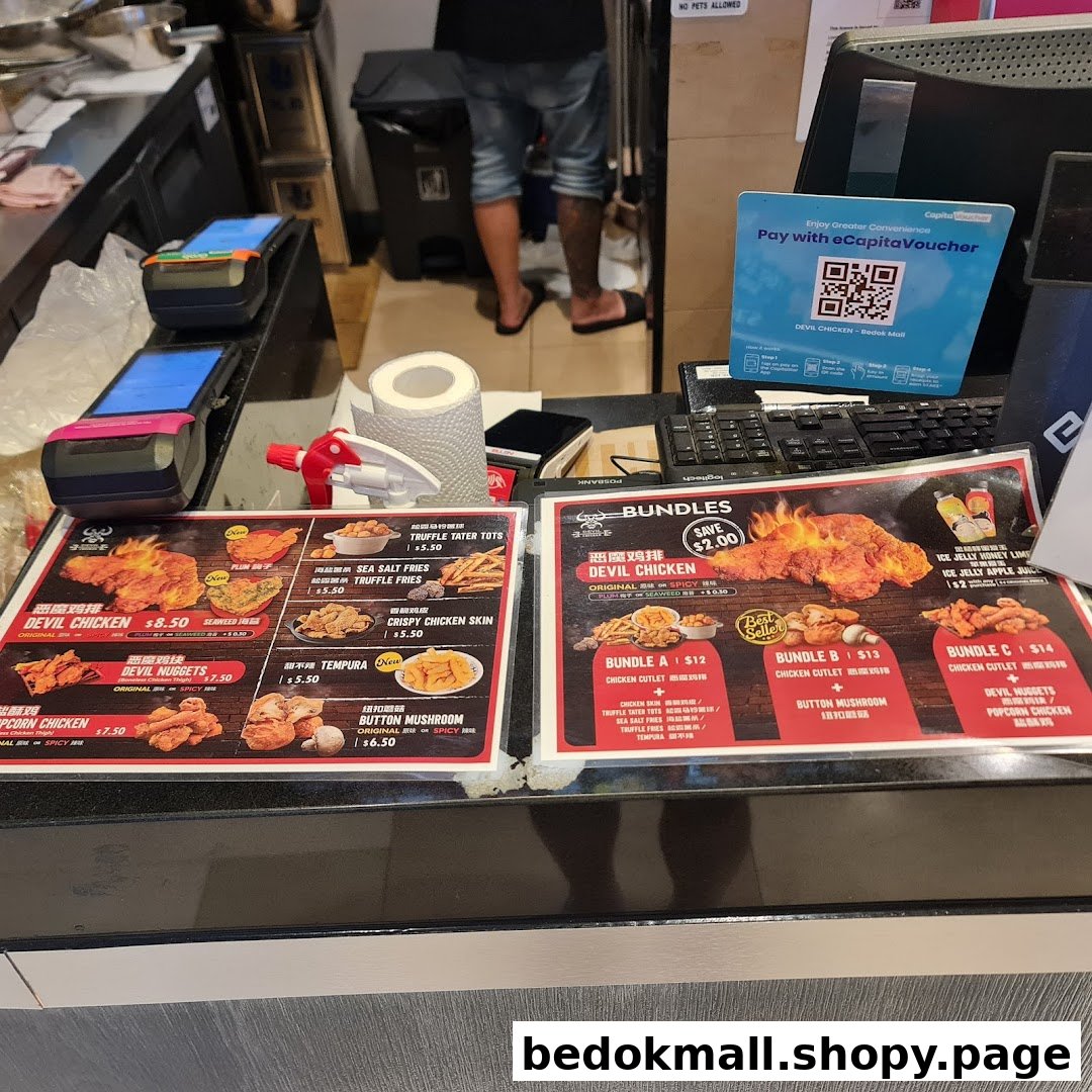 A shop counter with payment terminals, a POS system, and food menus.