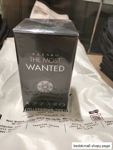 Azzaro perfume box on Dollars & Scent branded packaging.