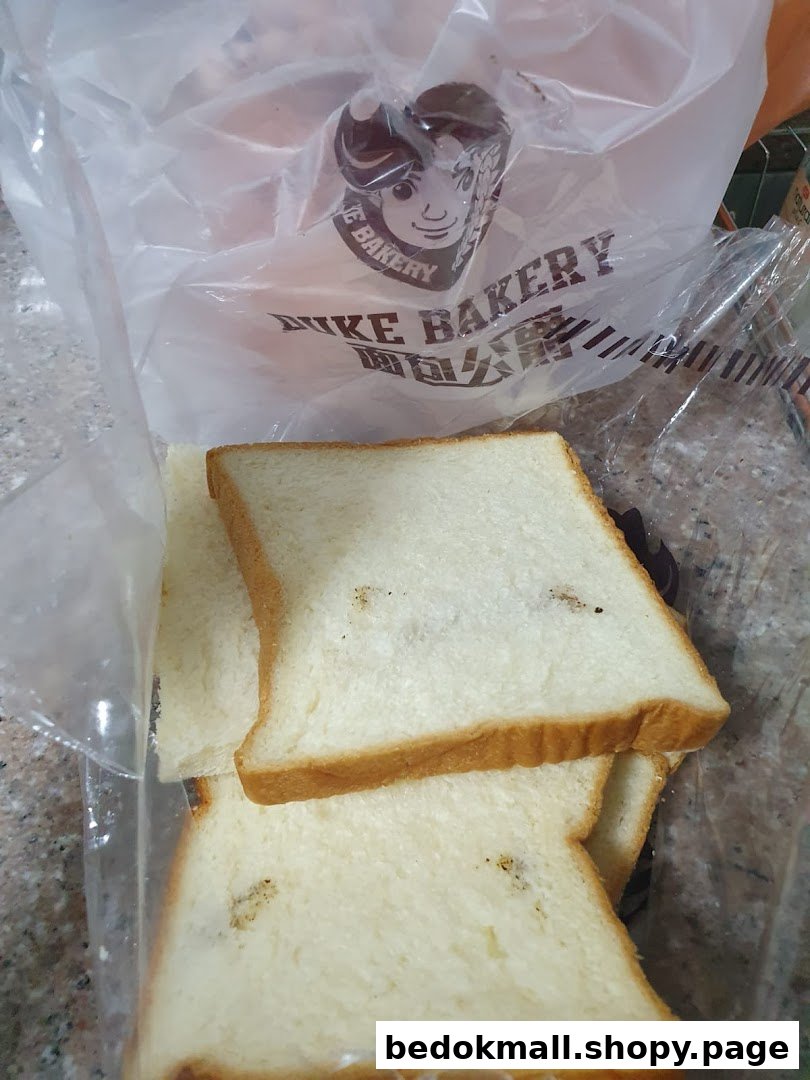 Sliced bread in a plastic bag with the Duke Bakery logo.