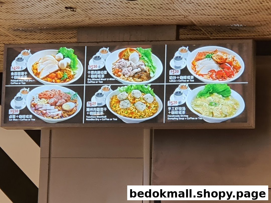 A digital menu board displaying various noodle and soup dishes with prices.