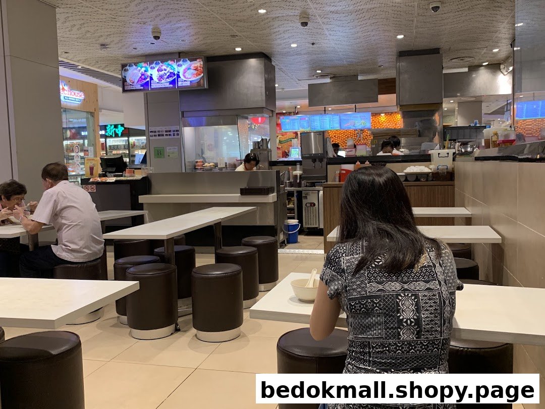 Customers dining at tables in a casual restaurant setting.