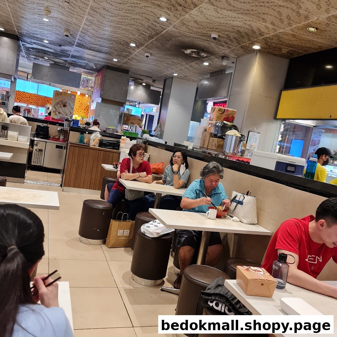 Customers eating at tables in a casual dining area or food court.