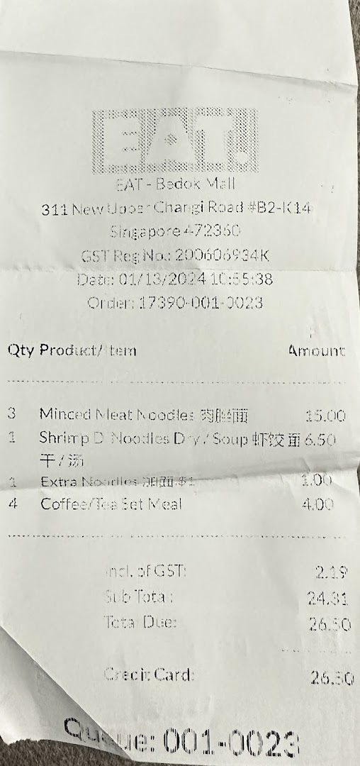 A paper receipt from EAT. showing itemized purchases and total cost.