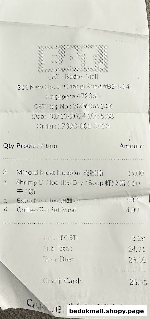 A paper receipt from EAT. showing itemized purchases and total cost.