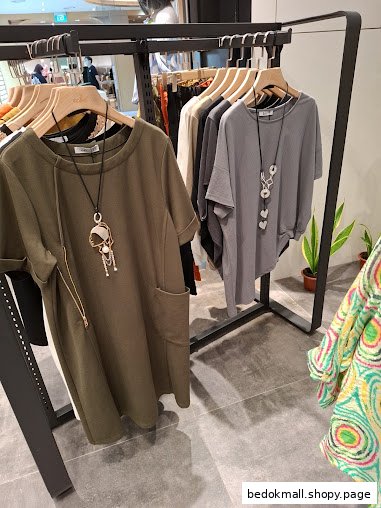 Clothing items displayed on racks inside a retail store.