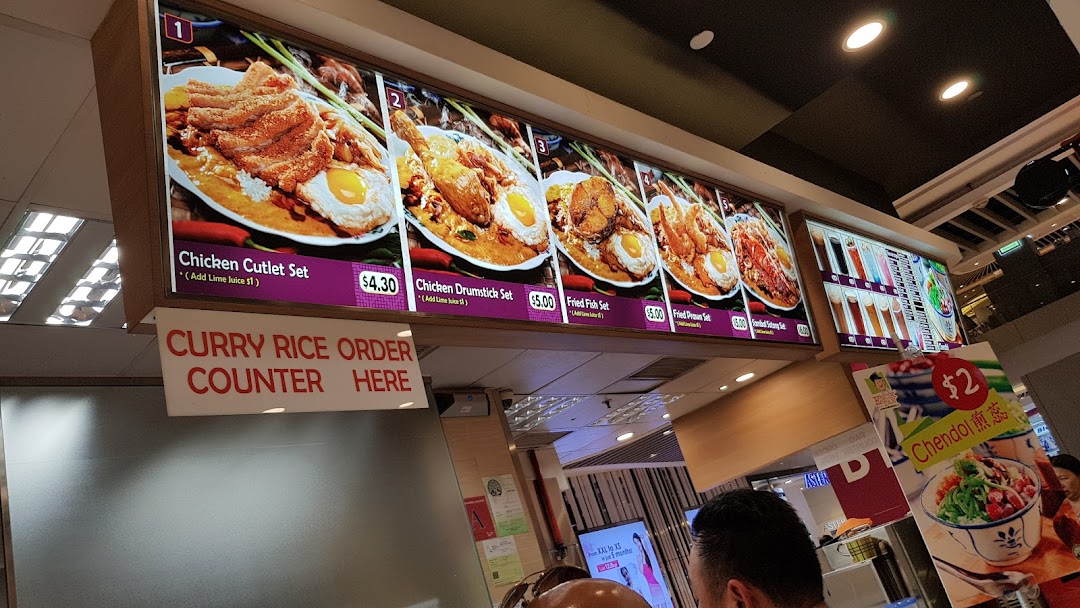 Digital menu board displaying various food items and prices at a food stall.