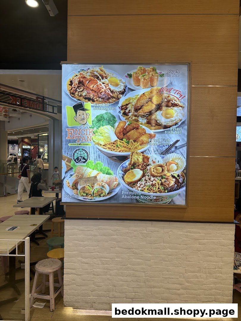 Large illuminated menu board displaying various food dishes from Encik Tan.