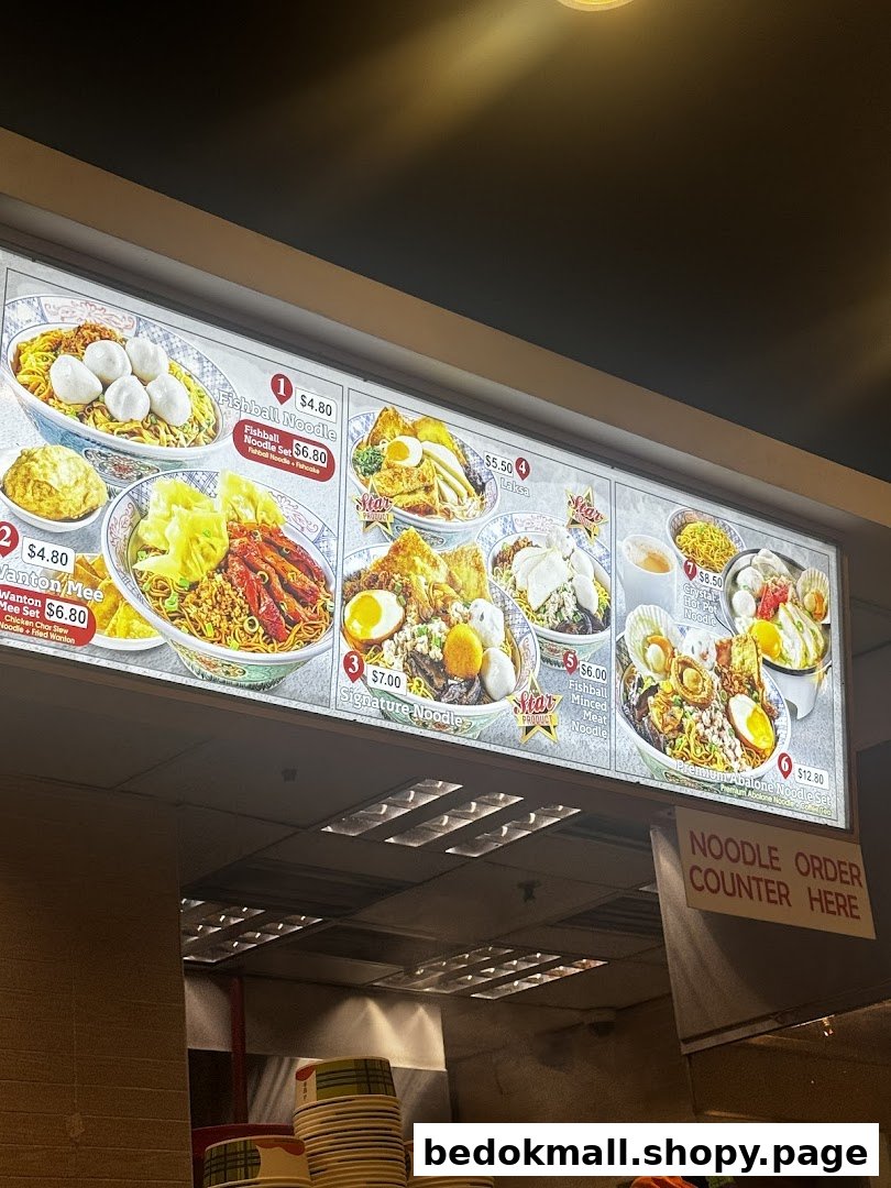 Illuminated menu board displaying various noodle dishes with prices.