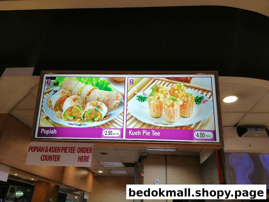 Menu board displaying Popiah and Kueh Pie Tee with prices.