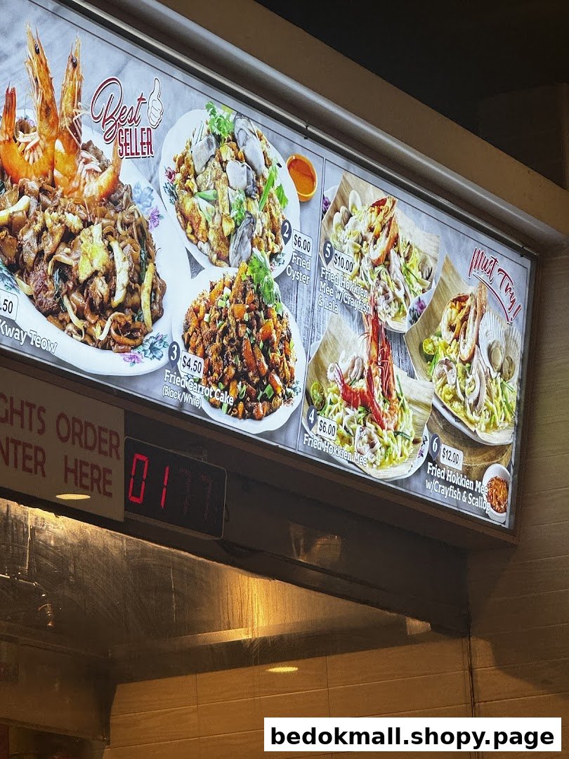 A brightly lit menu board displays various Asian food dishes with prices.