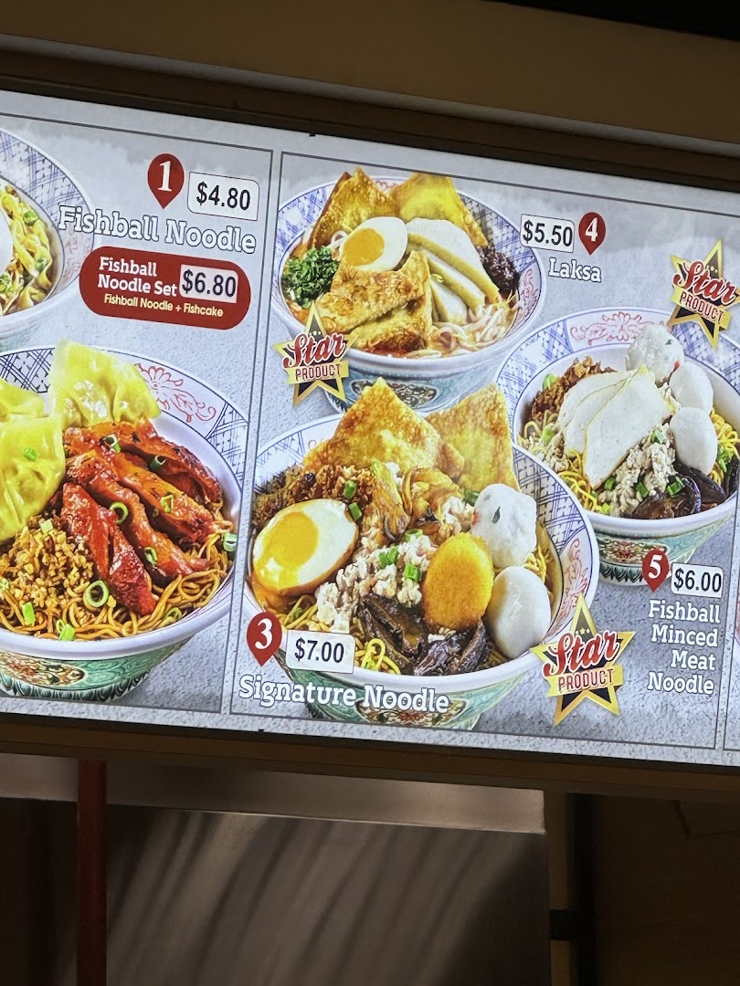 A digital menu board displaying various noodle dishes with prices.