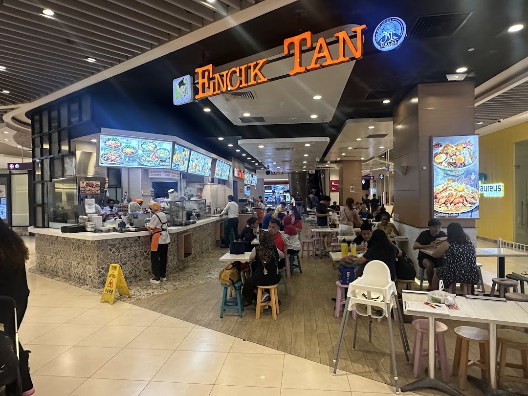 Interior view of Encik Tan food stall with customers dining.