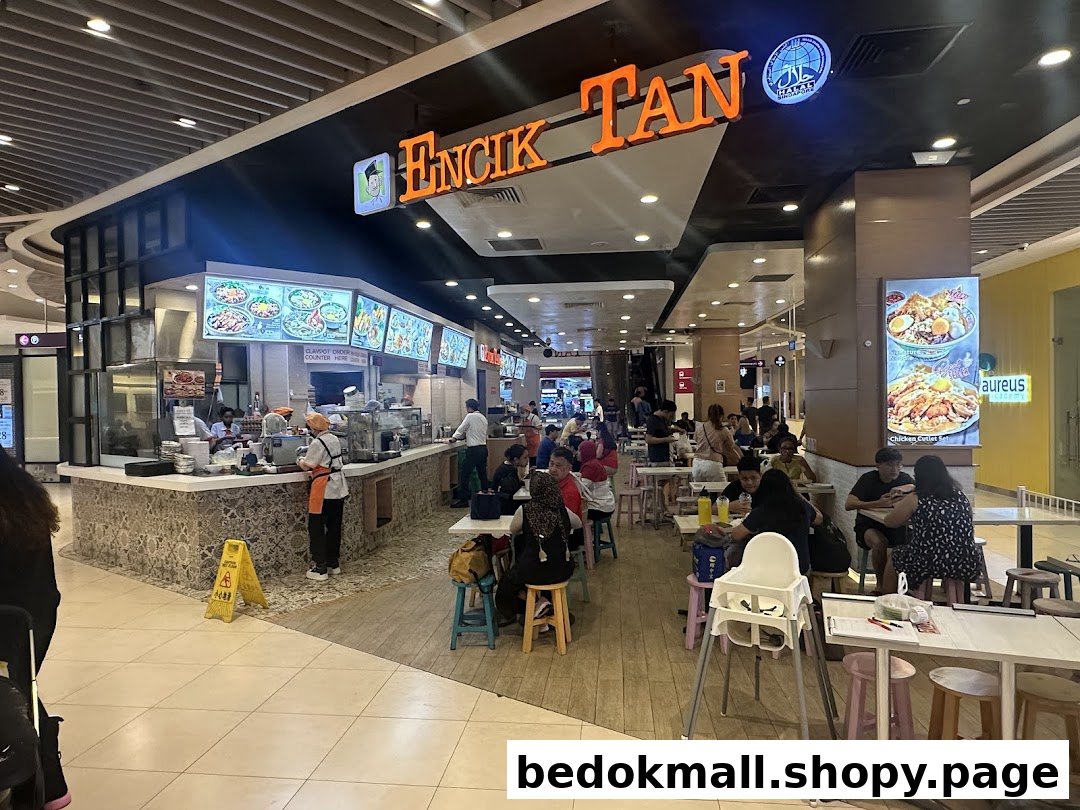 Interior view of Encik Tan food stall with customers dining.