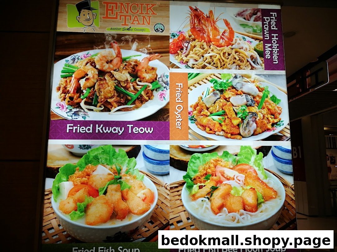 A large display board showing various food dishes and their names.