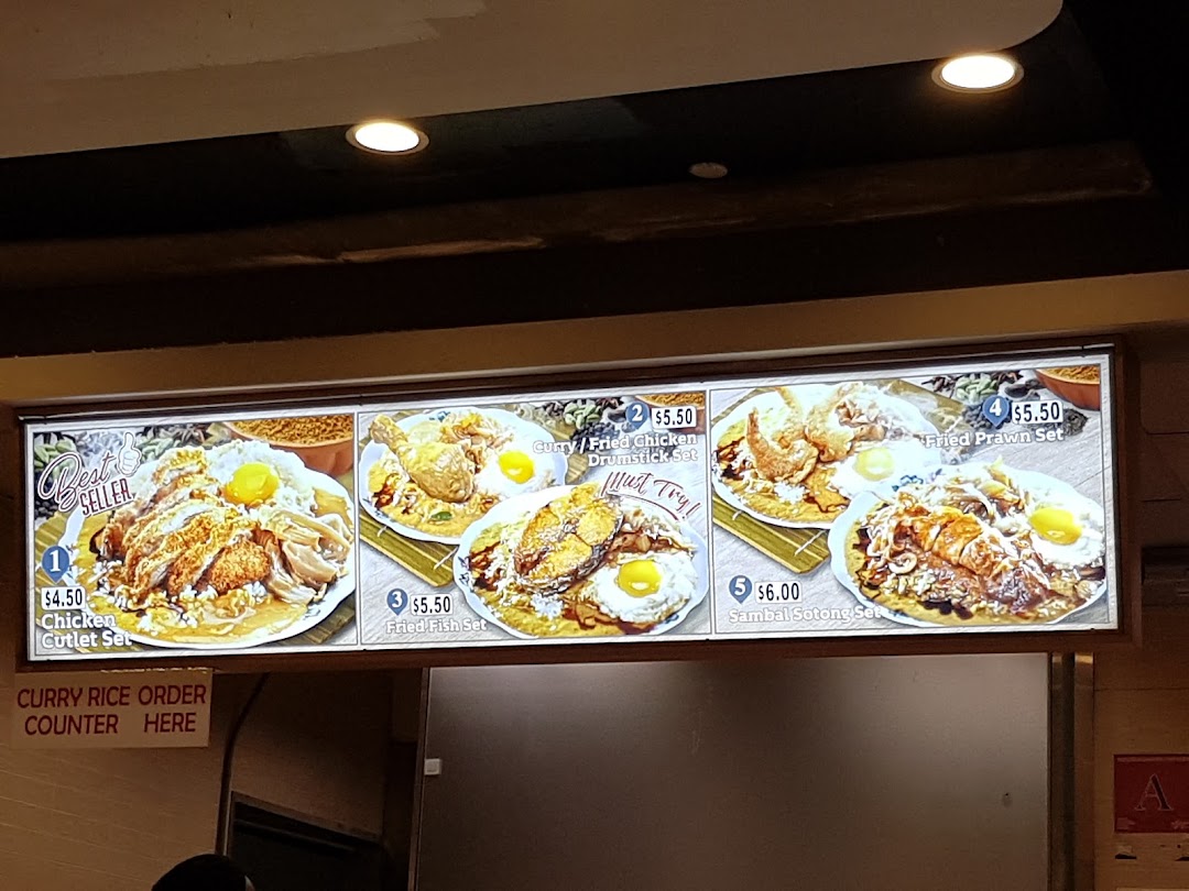 A display board showing various food sets with prices and descriptions.